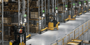 Warehouse with forklift trucks, rack protection and pedestrian barriers.