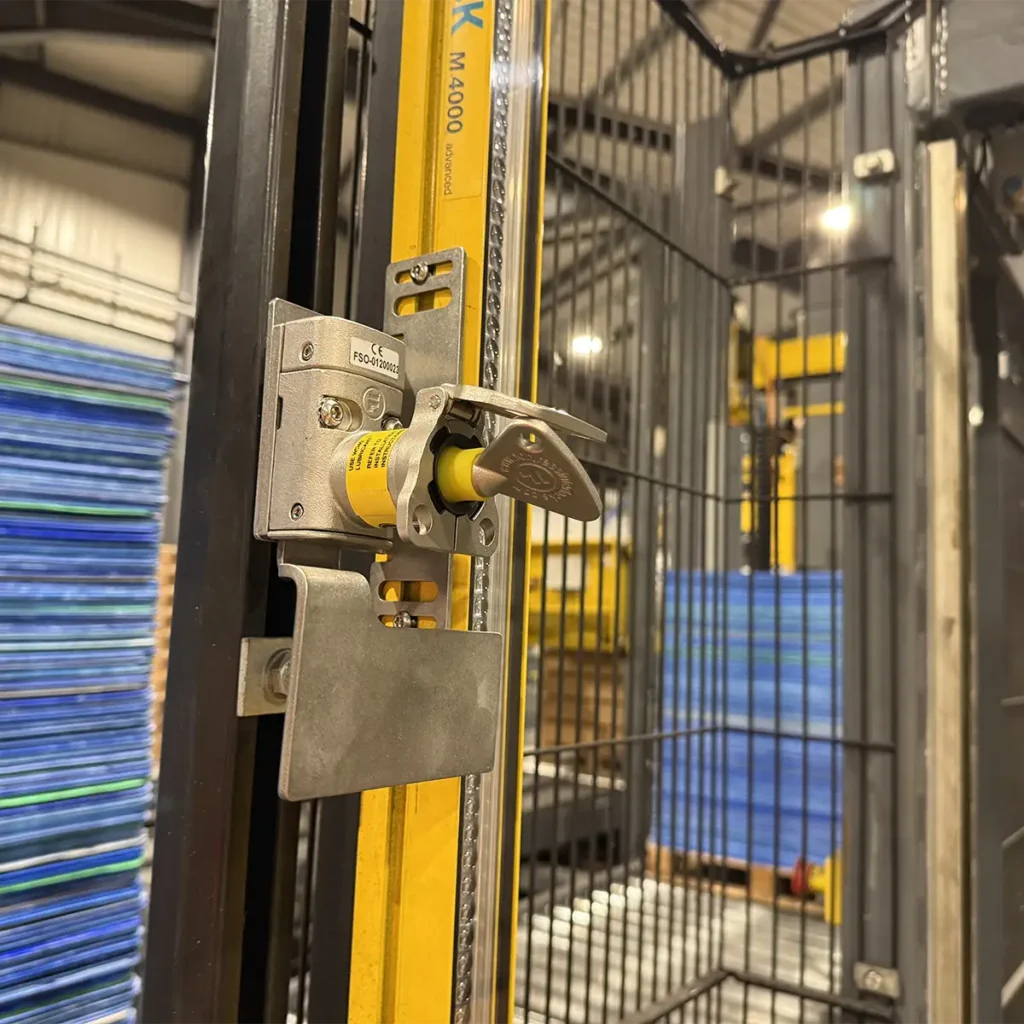 Trapped key blocking devices fitted to palletiser guard interlocks